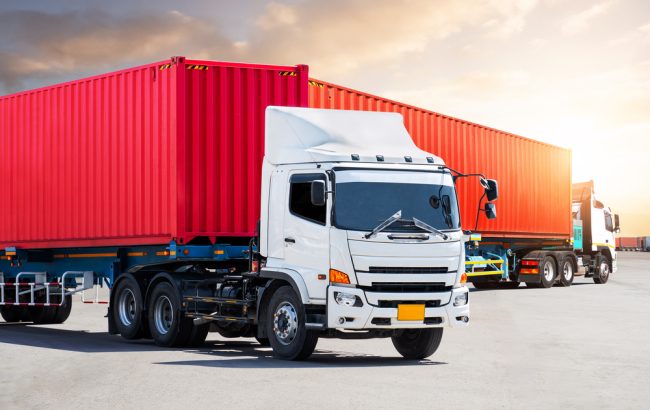 Semi Trailer Trucks on The Parking Lot with Sunset Sky. Big rig, Tractor Truck. Economy Business Transport on Road. Shipping Container Import- Export. Warehouse Port. Freight Logistics Transportation.